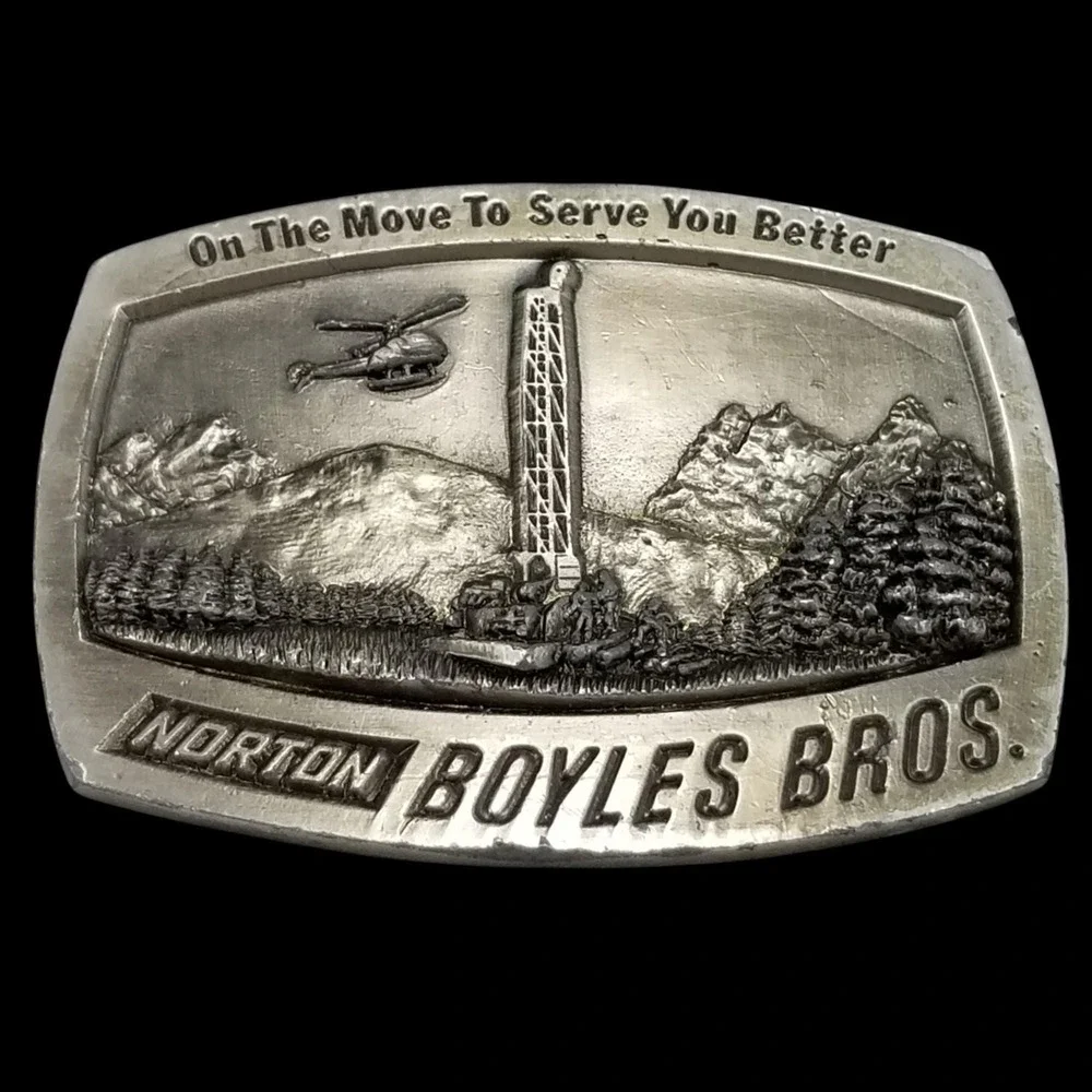 Amwest Casting Belt Buckle - Norton Boyles Bros Collectible with Mountain Scene